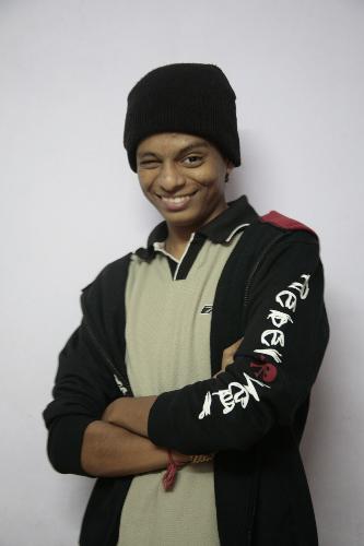 me  - i am wearing a monkey cap with pieceried lips,in a cool jacket,smiling for the camere blinkin eyes