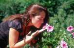 Can you smell the flower's - A girl smelling flower