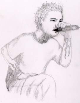 this is CHESTER BENINGTON  - The very special feature of this photo is that it is the animated photo the renowned singer Chester benington , lead singer of linkin park . THIS PICTURE IS VERY UNIQUE IN ITS KIND  In this picture , chester is singing a song in its own style  this is an awesome picture
