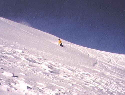 Snowboarding in powder - A guy snowboarding in powder in Colorado.