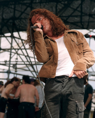 Pearl Jam Captured Pictures -  Pearl Jam rose from the ashes of Mother Love Bone to become the most popular American rock roll band of the '90s. After vocalist Andrew Wood overdosed on heroin in 1990, guitarist Stone Gossard and bassist Jeff Ament assembled a new band, bringing in Mike McCready on lead guitar and recording a demo with Soundgarden's Matt Cameron on drums. Thanks to future Pearl Jam drummer Jack Irons, the demo found its way to a 25-year-old San Diego surfer named Eddie Vedder, who overdubbed vocals and original lyrics and was subsequently invited to join the band (then christened Mookie Blaylock after the NBA player). Dave Krusen was hired as the full-time drummer shortly thereafter, completing the original lineup. Renaming themselves Pearl Jam, the band recorded their debut album, Ten, in the beginning of 1991, although it wasn't released until August; in the meantime, the majority of the band appeared on the Andrew Wood tribute project Temple of the Dog. Krusen left the band shortly after the release of Ten; he was replaced by Dave Abbruzzese. Ten didn't begin selling in significant numbers until early 1992, after Nirvana made mainstream rock radio receptive to alternative rock acts. Soon, Pearl Jam outsold Nirvana, which wasn't surprising -- Pearl Jam fused the riff-heavy stadium rock of the '70s with the grit and anger of '80s post-punk, without ever neglecting hooks and choruses; 'Jeremy,' 'Evenflow,' and 'Alive' fit perfectly onto album rock radio stations looking for new blood. Pearl Jam's audience continued to grow during 1992, thanks to a series of radio and MTV hits, as well as successful appearances on the second Lollapalooza tour and the Singles soundtrack (Stone Gossard also embarked on a side project called Brad, which released the album Shame in early 1993).