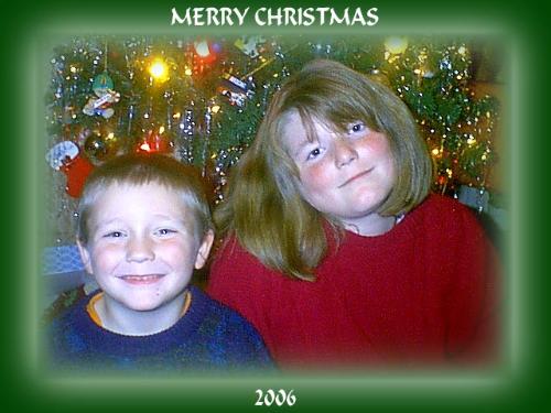 My Children, December 2006 - This is a picture of my children this Christmas.  They are in front of the christmas tree hamming it up for the photo that we put in our Christmas cards every year.