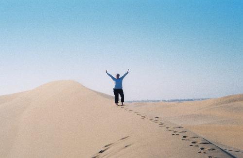 beaches are great - This photo was taken of me on top of a sand dune I just climbed at the coast in Namibia, Africa.