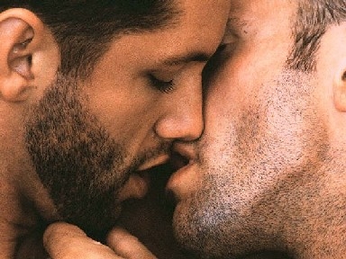 two adult men kissing each other - Two adult men kissing each other