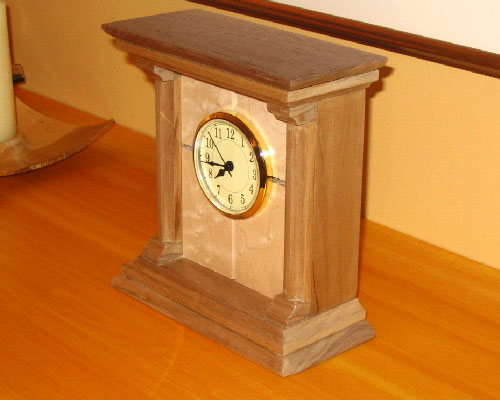 Woodworking project - clock - This is a clock I made for my mother as a gift last Christmas.  The body is cherry and the face is birds-eye maple.