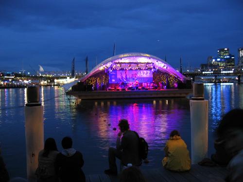 Jazz concert on the water - This is a floating shell that houses a band...it creates a fabulous venue for a concert...the waterfront is filled with folks milling around and the light show on the water is awesome.  This one is in Sydney, Australia and is a band named Bomba...what an excellent sound experience...