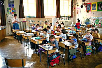 Kids in classroom - the teacher is learning the kids