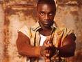 Akon - Akon on a brown background