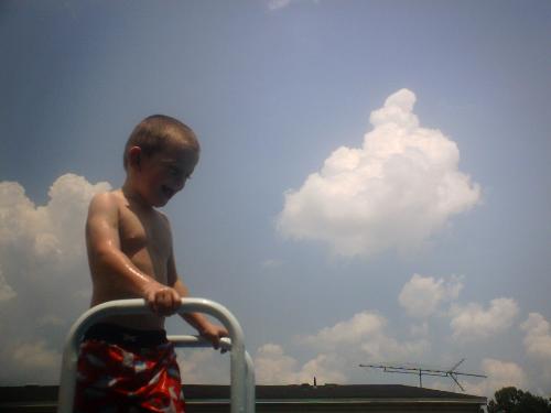 Grayson - I won first place in a photo contest for this photo. My son was terrified of water but would climb the ladder.