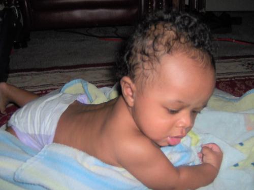 Baby boy - A picture of my first son at 4 months old. He was a muscle man, even then!
