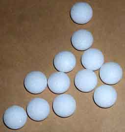Mothballs - Loose moth balls rolling around on the floor