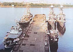 indian navy ship - Line-up of Indian Naval ships on Mumbai dockyard breakwater during the crucial three days of the Rin Mutiny