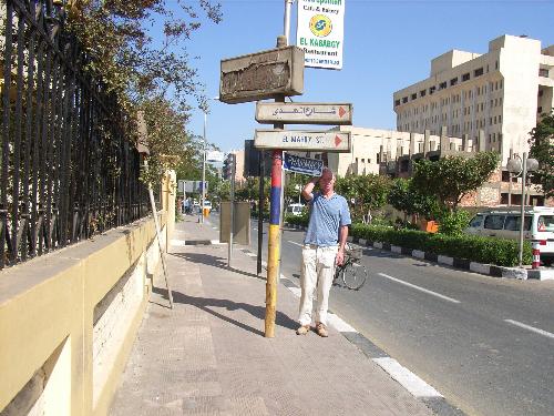 Myself in Luxor, Egypt. - This is me posing beside a sign pointing twards a pharmacy. Funny caption wanted!
