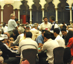 Paying Poker Around Table - Men playing poker in a casino