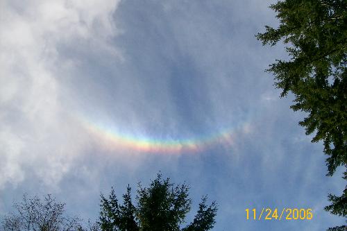 rainbow - this is the coolest rainbow I have ever seen, its upside down. I have never seen one that curves up instead of down.