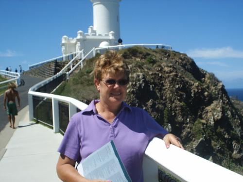 Barbara & Byron Bay Lighthouse - Me half-way up the hill! In the background is Byron Bay Lighthouse where there are magnificent views of the Byron coastline. From the top there are 360 degree views;  whales are often spotted here in season, when they are swimming up to the warmer waters of Hervey Bay. Dolphins play here all the time.