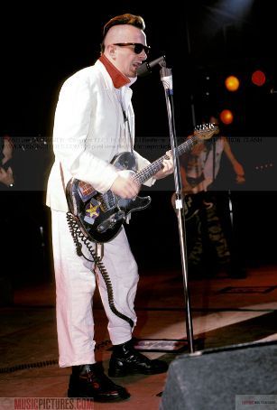 joe strummer - the legendary joe strummer in an early looking photo. the inspirational frontman of the clash unfortunately died a few years back with sudden heart attack. he leaves behind a legacy that will be hard to surpass. with his sometimes humourous lyrics and social issues he tackled, he was a very liked and respected frontman.