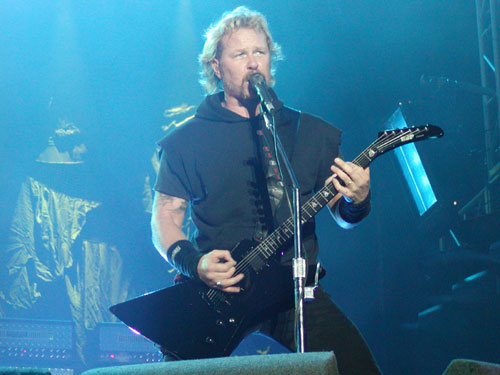 James  - The vocalist and the founder of the Band during one of his live performances.