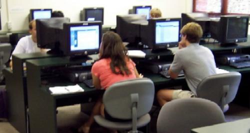 My sister needs a website/company to study Englis - Studentslearning languages in a computer lab. My sister needs a website/company to study Englis - Studentslearning languages in a computer lab.