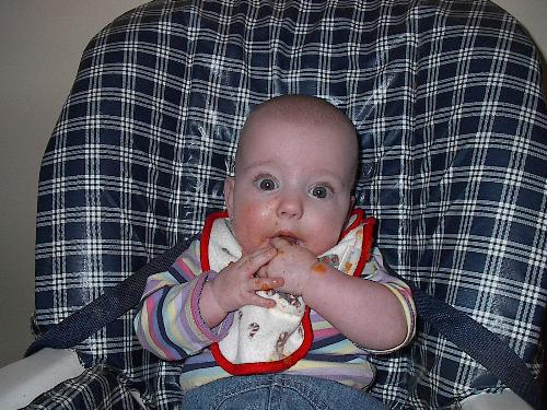 messy carrot face - baby with a messy face after eating carrots.