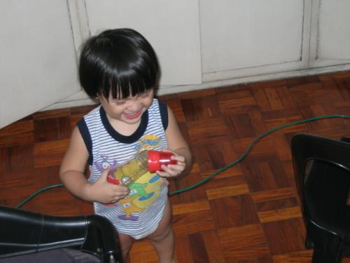 kid preparing milk bottle - my son imitates me in preparing his milk bottle