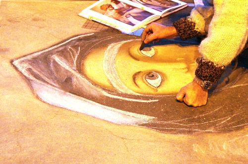 Street Art - This is a pic I took of two street artists in Rome.  The chalk art they were creating was amazing, even down to the texture in the background (which I don't think can be seen on this photo).  I absolutely love this kind of art and the freedom of expression it represents; I also love how temporary it is - art for the sake of the love of art (and a little bit of change in a hat!)
