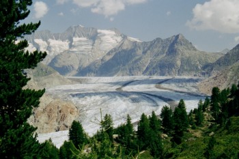 nature - a beautiful picture .
with snow,mountains,and sunshine.