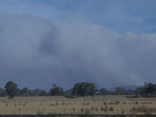 Bushfires near Benalla in Victoria, Australia. - Smoke rises from the hills as seen from the Humme Highway, near Benalla, in Victoria's North East. Picture taken on Jan 13, 2007.