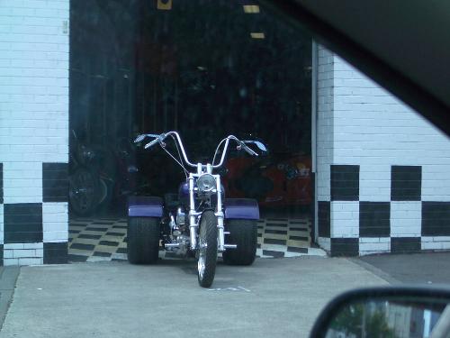 Motor tricycle. - A motor tricylcle in a shop driveway in Melbourne, Victoria, Australia.