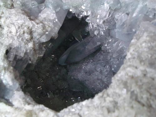 Large crytals of Celestite - Large pale blue crystals of Celestite, or strontium sulphate, can be seen in this large geode.