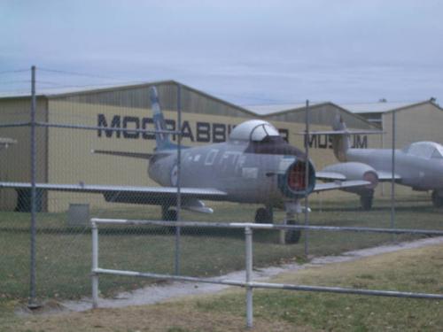Sabre jet fighter at Moorabbin air museum, Melbour - A sabre jet fighter sits behind a fence at the Moorabbin air museum at Moorabbin in Melbourne, Victoria, Australia's south east. Australia's airforce flew sabre jets for many years.