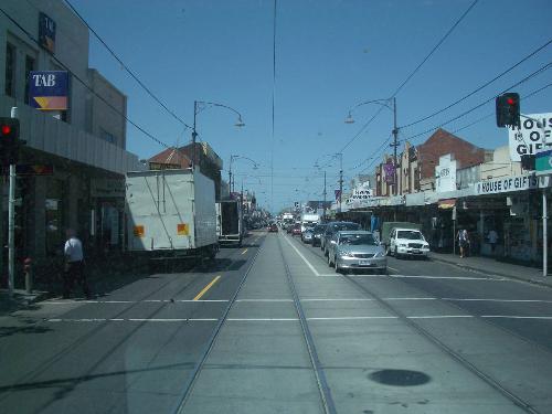 Tramcar rails down the middle of the road - Tramcar rails going down the middle of the road. Typical of tram lines in Melbourne, although some lines do run off in strange places.