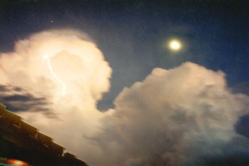 storm - A storm cloud rising in the Ozarks'skies, see the lightning streak?