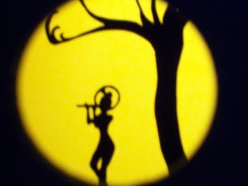Krsna - This is an art project my daughter did for me for my last birthday.  She made this then put it in a 'shadow' box of sorts, with a hole in it to look through.  You put it in the sunlight, and it looks like this.