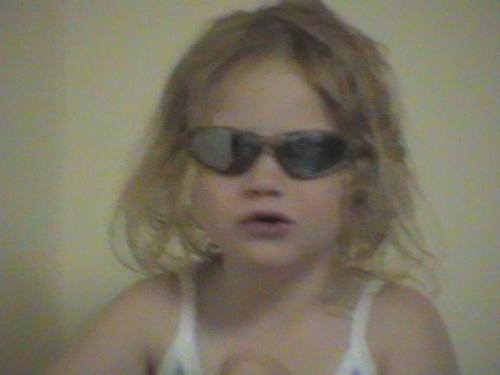 amy - Granddaughter in shades in summer 2003.
