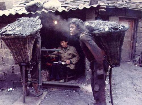 Work, real labor! - Wang Zhizhong worked as a coal carrier. Carrying a basket of coal weighting 40kg(88 lb), he made his way up a 100m deep mine, and then walked a distance of 1000m along a mountainous  track. For each trip, he made 1RMB (0.125 USD). He was 17.