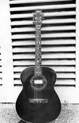 Playing guitar - An accoustic guitar with an awesome look. Im love with this accoustic guitar. Check out the picture of this accoustic guitar!