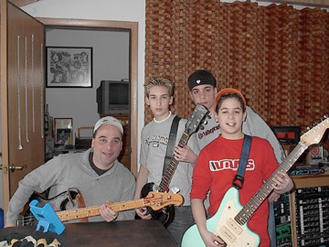 Playing guitar 7 - Three guys are playing guitar from their home. Check out the picutre