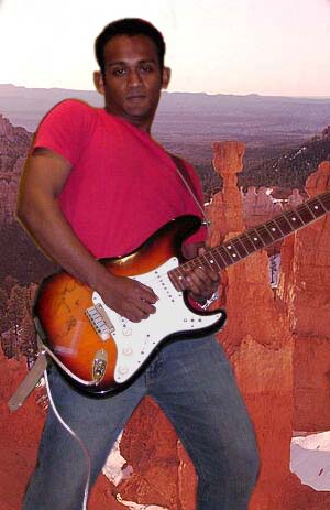 Playing guitar - I started playing guitar on a cheapo nylon acoustic which had an action a mile high - in the end this probably helped my playing no end. Now, I play lead for the Consultants through a Boogie DC 5 amp, a Lexicon MPX G-2 and a couple of guitars (see Gear Sections). My main influences are Santana, Clapton and Hendrix, etc., etc. but really any good song with a decent riff will fill my cup of tea just fine.