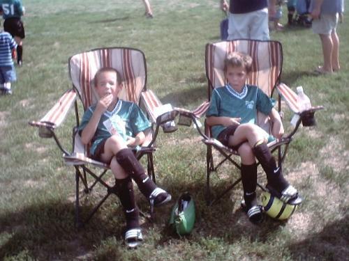 Relaxing after their first game - Kicking back after their first soccer game!
