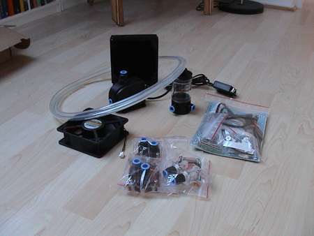 Asetek Waterchill V2 - You will get everything you'll need to to get this kit running, you can buy different kits from asetek's webstore, or from your local modding store.  I received 3 waterblocks, the CPU block, the gpu block, and the northbridge block. You'll be able to order extra blocks directly from Asetek, or from your local modding store if needed. You'll get a bag full of instructions and mounting hardware, the waterblocks, the pump, the reservoir, the tubing and the radiator, pff and all that in one sentence!. Here's a full list of goodies  # WaterChill CPU Cooler block supporting Intel P4 S478, AMD socket A and Hammer; Also includes an extra lid for 100% motherboard compatibility including motherboards that due not follow AMD's 'Keep Out Area' standards # WaterChill Chipset Cooler for VIA and AMD chipsets # WaterChill VGA Cooler supporting GeForce 2, GeForce 3, GeForce 4, GeForce FX, Radeon 9700, and Radeon 9800 # Black Ice Pro Radiator with push on fittings # 120 mm Low Noise Sunon Fan # 1200 l/hr L30 Hydor Pump with push on fittings # WaterChill Control Unit with SafeStartTM, NoiseControlTM and LED connection # WaterChill Plexiglas Reservoir # WaterChill Tube Set (2,5 mtr.) # ALL fittings and mounting accessories are included # Anti Algae Fluid - 25 ml bottle # Heat Conduction Compound - 2 ml tube # Installation Manual