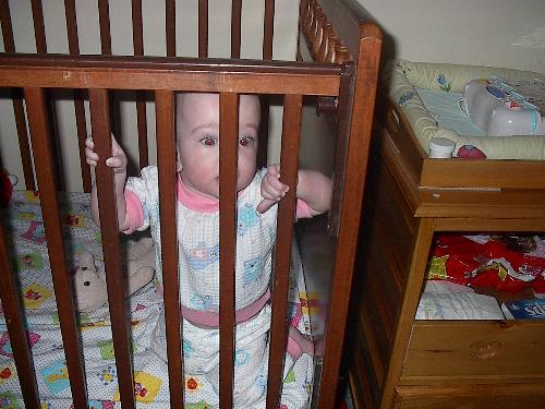 baby in crib - baby in her crib.