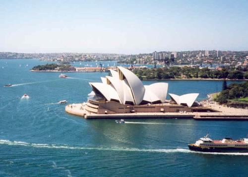 An arial view of the Sydney Opera House  - THis is a picture of when I was in a helicopter ride hovering the city of the Sydney Opera House