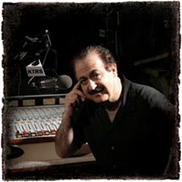 George Noory in his studio - If I remember correctly he broadcasts most often from St. Louis. I could be wrong though.