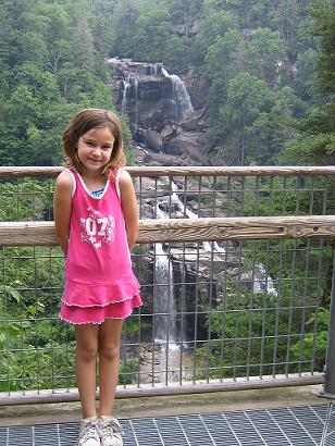 KAYLA - This is my daughter Kayla. She is the light of my life. In this picture she is 7 but as of now she is 8. We took this picture in  North Carolina near a waterfall. We had the most fun up there.