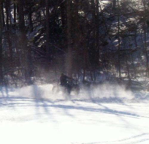 4-wheeling fun in the snow - my man on his 4 wheel this morning ,playing in the snow.