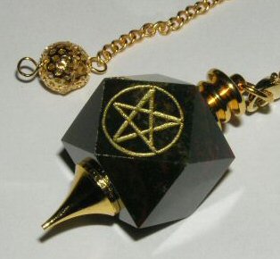 My Dowsing Crystal - This is a photo of my dowsing crystal that I use on a daily basis. It is a bloodstone crystal with a pentagram etched into it.