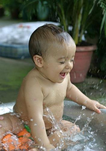 baby boy - baby boy playing in water tub