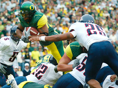 Arizona vs Oregon - Oregon running back goes airborne for the extra yardage.