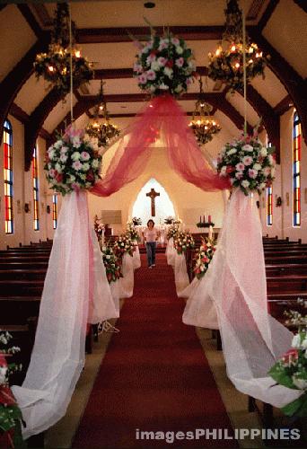 church aisle - Church picture was taken in the Philippines.  Aisle is decorated with wedding flowers, ribbons and tulle.